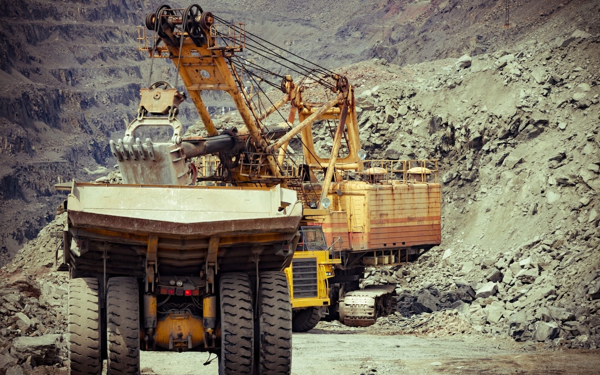 Open-Pit Mine With Large Hydraulic Shovel Loading A Mining Truck Using Rugged Heavy Duty Parts