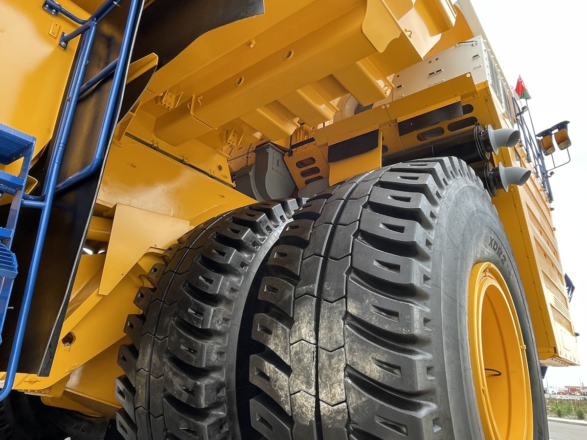 Close-Up Of Giant Mining Haul Truck Tires — Mine Site Supplier Dba Silencing Exhaust Components