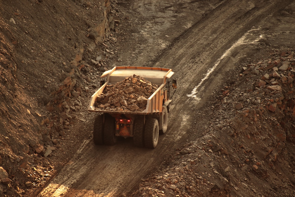 Dump Truck Driving On Mine Site — Dba Silencing Coolant Systems Prevent Mining Truck Overheating