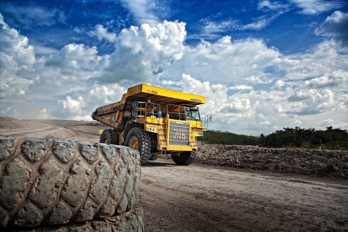 Yellow Haul Truck On Grey Mine Haul Road — Prevent Mining Truck Overheating With Dba Components