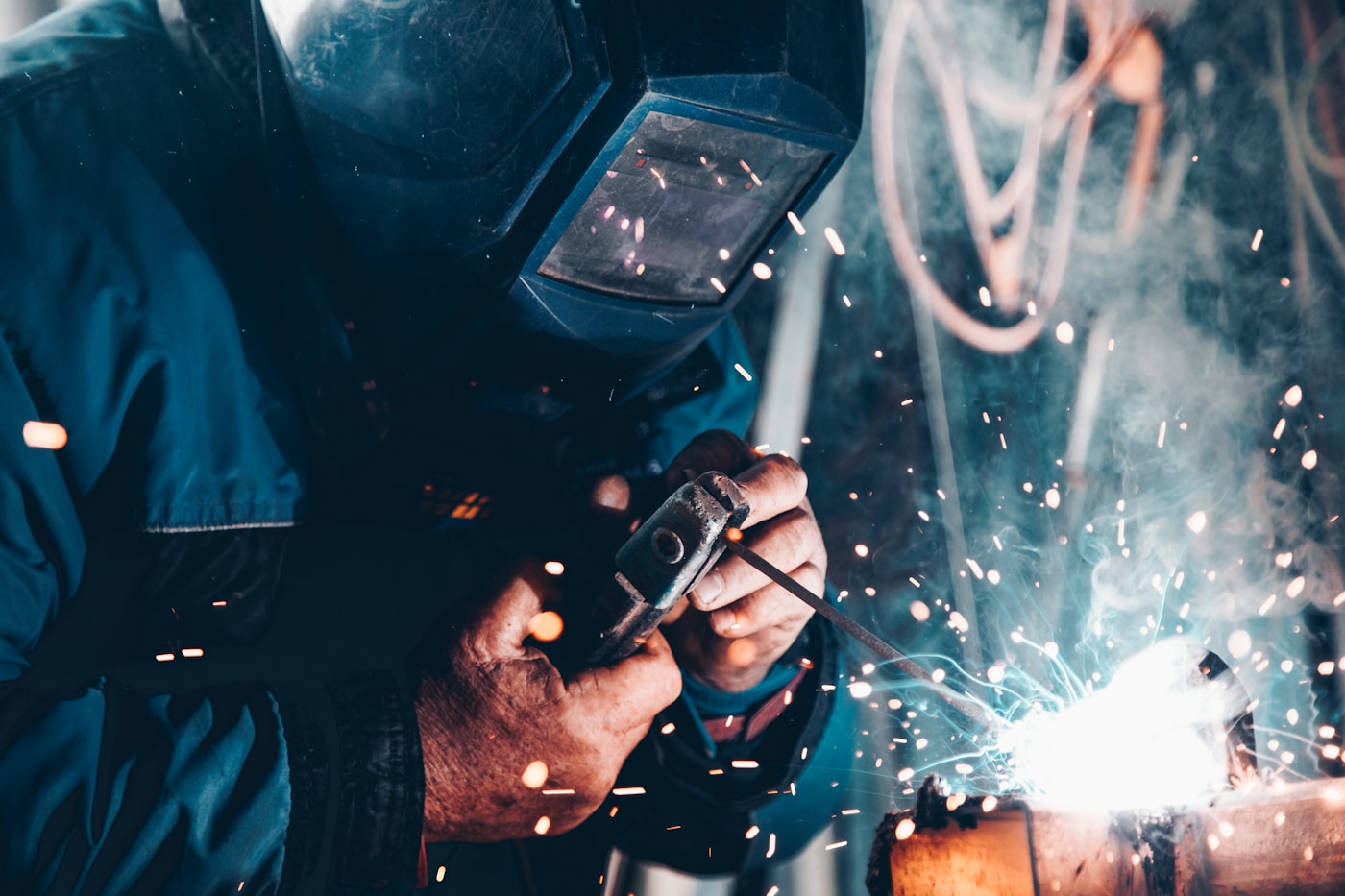 Metal Fabricator Working On Exhaust System — Dba Silencing Mining Truck Exhaust Parts Hand-Made